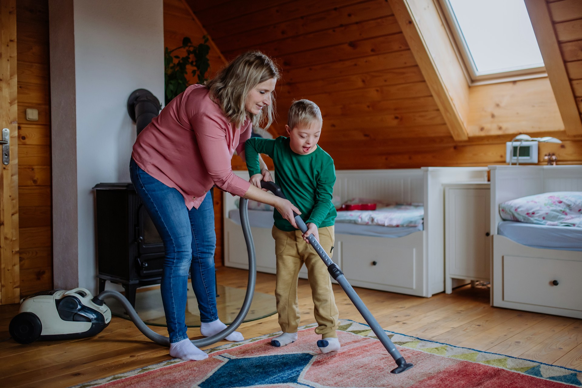 mother and son vacuuming