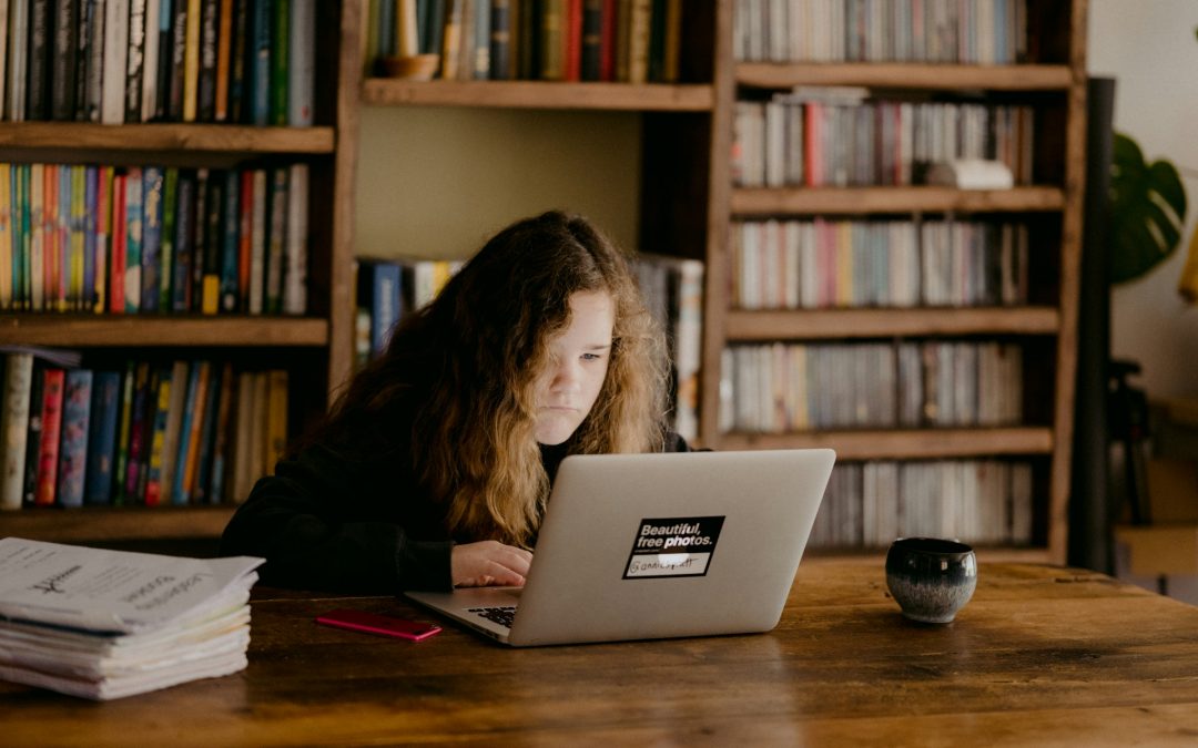 girl doing homework at home